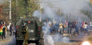 Casos de covid-19 se disparan en Chile y militares se despliegan en zonas pobres tras protestas