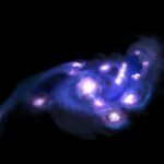 El James Webb y ALMA muestran una galaxia rotante con un enjambre de cúmulos estelares