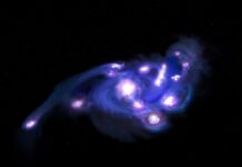 El James Webb y ALMA muestran una galaxia rotante con un enjambre de cúmulos estelares